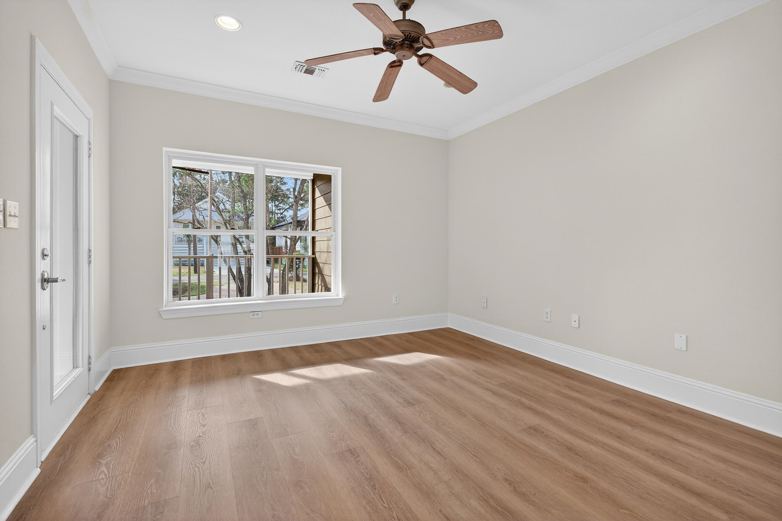159 7th Street Santa Rosa Beach, FL 32459 - Photo 6 of 53 a view of an empty room with wooden floor and a window