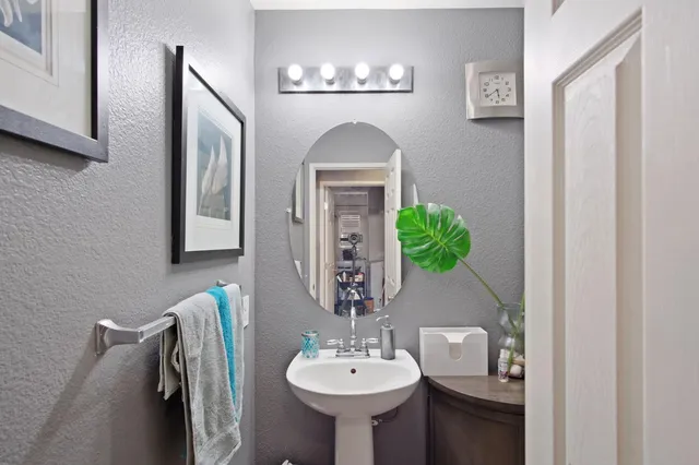 a bathroom with a sink and a mirror
