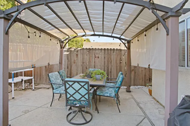 a view of a chairs and table in the patio