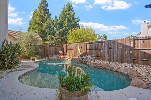 a view of a backyard with sitting area