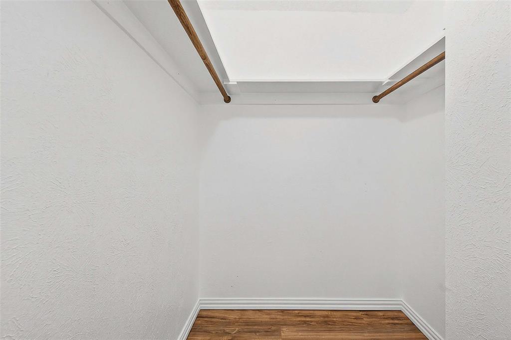 11460 Audelia Road, Unit 287 Dallas, TX 75243 - Photo 23 of 39 Walk in closet with wood finished floors