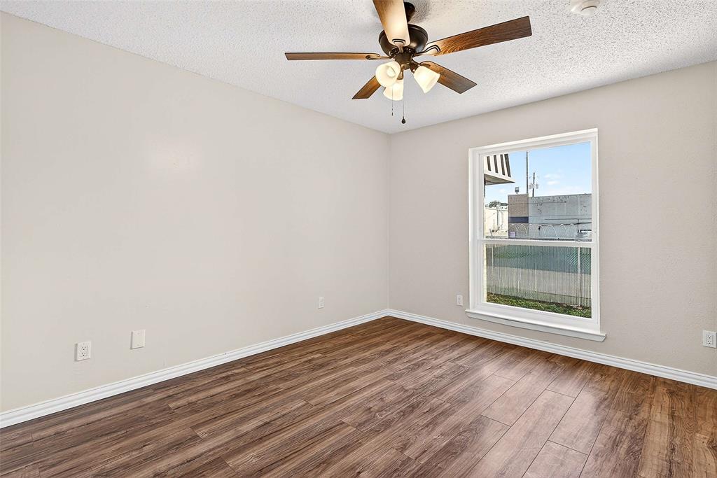11460 Audelia Road, Unit 287 Dallas, TX 75243 - Photo 29 of 39 bedroom with wood finished floors, a textured ceiling, and a ceiling fan