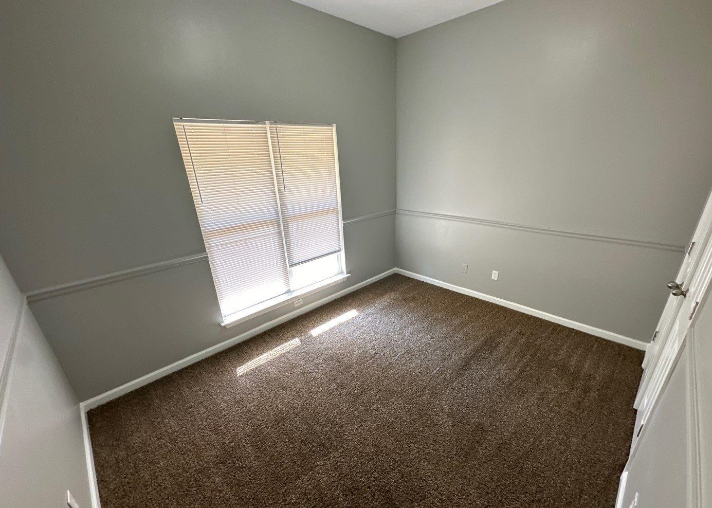 9420 Grove Road Cordova, TN 38016 - Photo 7 of 15 Unfurnished room featuring dark colored carpet and baseboards