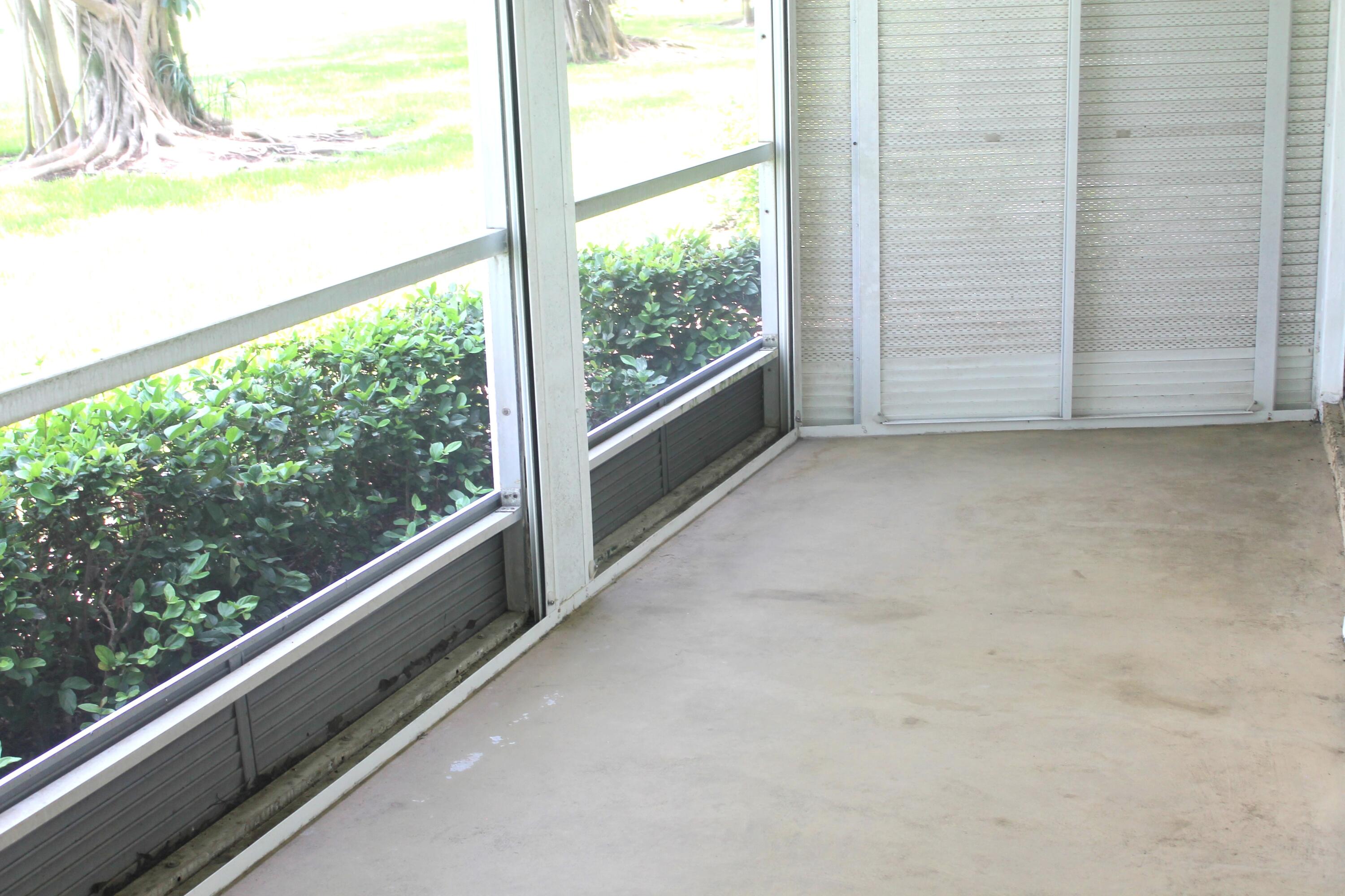 6461 Northwest 2nd Avenue, Unit 102 Boca Raton, FL 33487 - Photo 24 of 30 a view of a balcony with an outdoor space