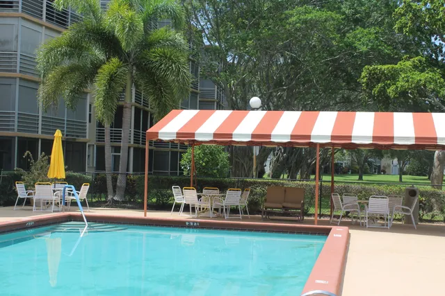 a view of swimming pool and lounge chair