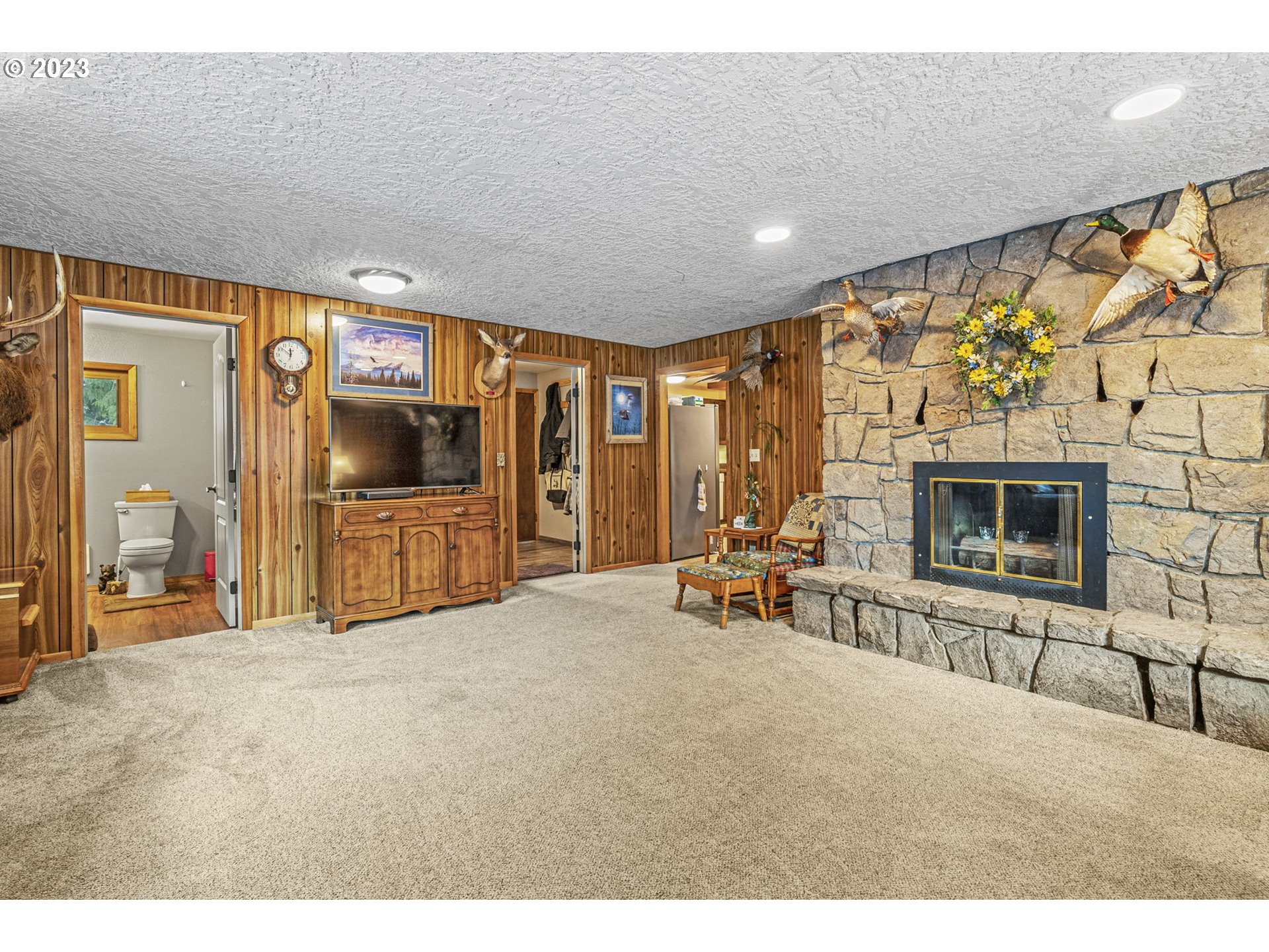 71 Stevens Road Washougal, WA 98671 - Photo 14 of 32 a living room with furniture and a flat screen tv
