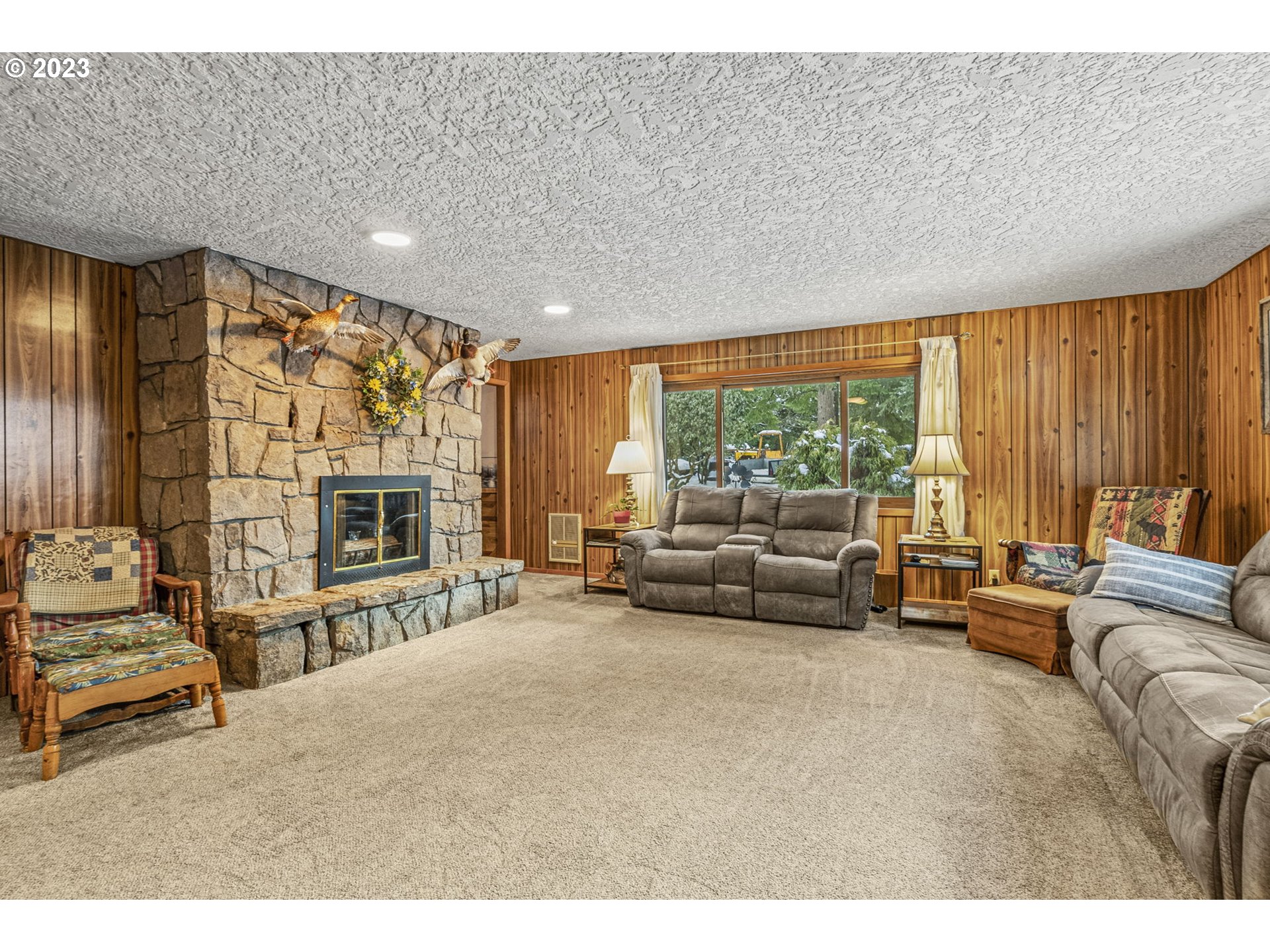71 Stevens Road Washougal, WA 98671 - Photo 16 of 32 a living room with furniture and a fireplace