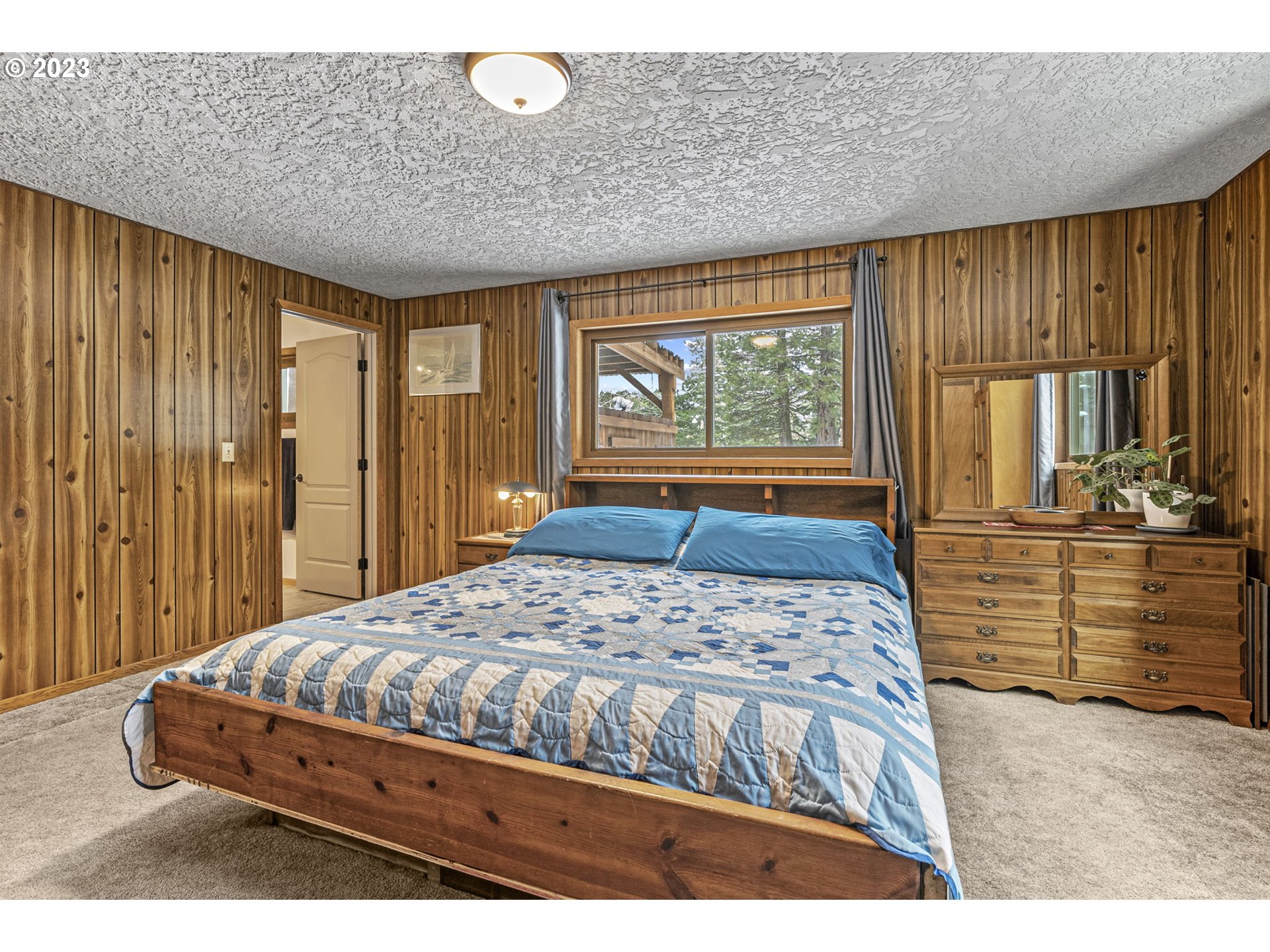 71 Stevens Road Washougal, WA 98671 - Photo 20 of 32 a bedroom with a large bed and windows