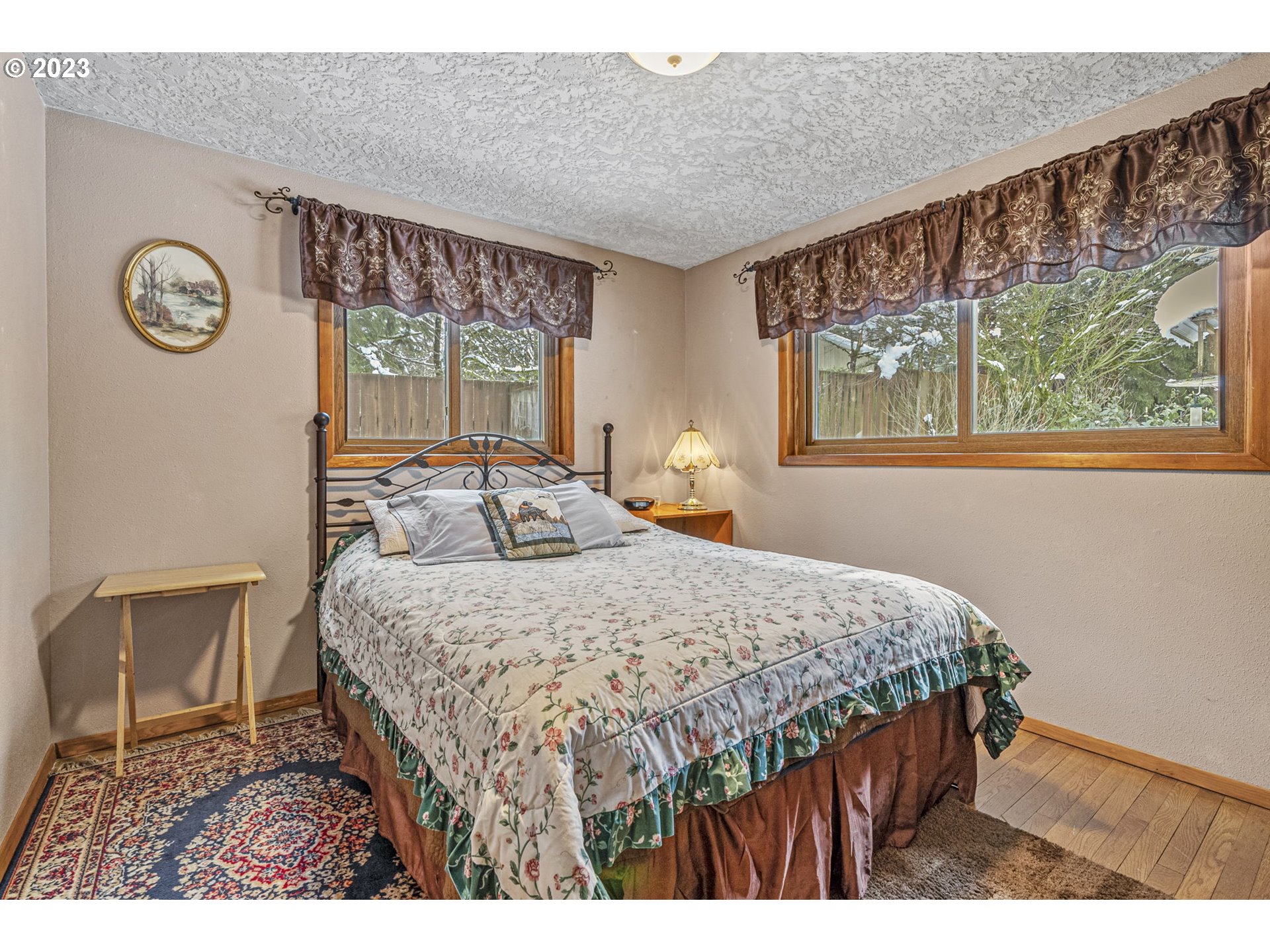 71 Stevens Road Washougal, WA 98671 - Photo 23 of 32 a bedroom with a bed and a table in it