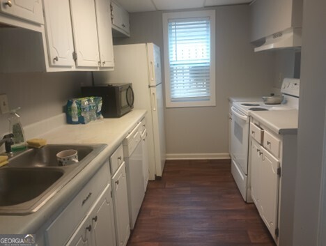 3168 Nectarine Circle Decatur, GA 30034 - Photo 3 of 9 a kitchen with a sink stove top oven and cabinets