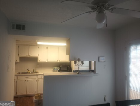 3168 Nectarine Circle Decatur, GA 30034 - Photo 4 of 9 a kitchen with a sink cabinets and window
