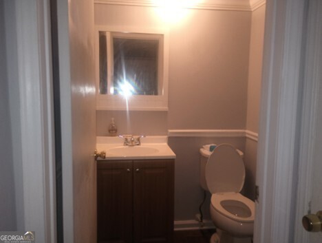 3168 Nectarine Circle Decatur, GA 30034 - Photo 6 of 9 a bathroom with a toilet a sink and mirror