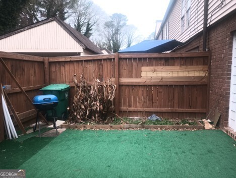 3168 Nectarine Circle Decatur, GA 30034 - Photo 9 of 9 a view of a backyard with table and chairs and wooden fence