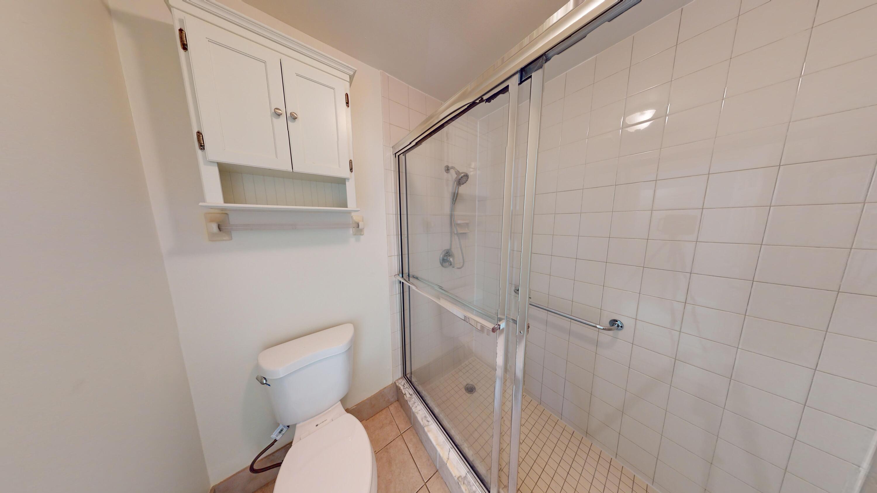 3149 Kingswood Terrace Boca Raton, FL 33431 - Photo 14 of 16 a bathroom with a toilet and a shower