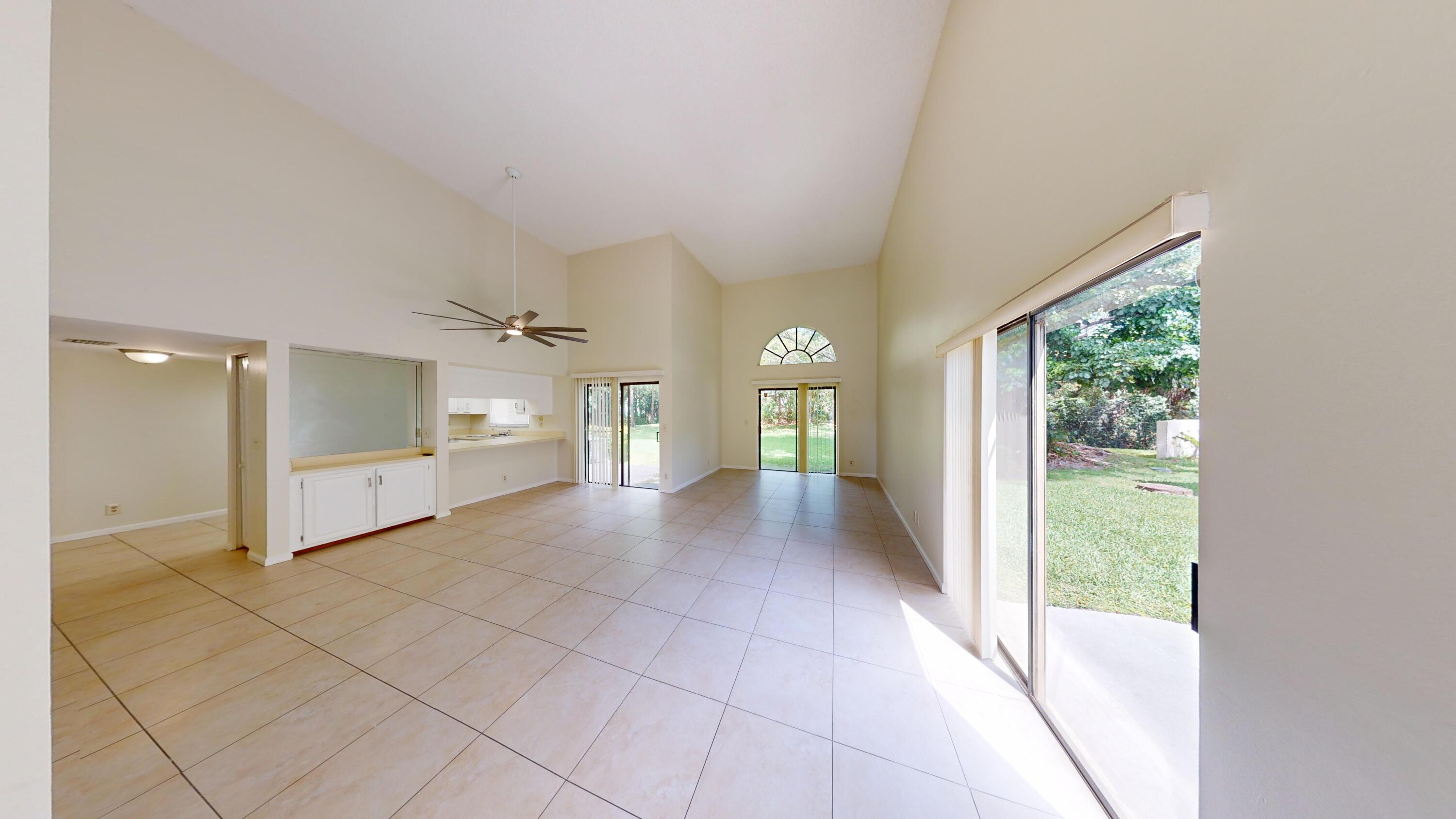 3149 Kingswood Terrace Boca Raton, FL 33431 - Photo 2 of 16 a view of a hallway with bathroom and shower