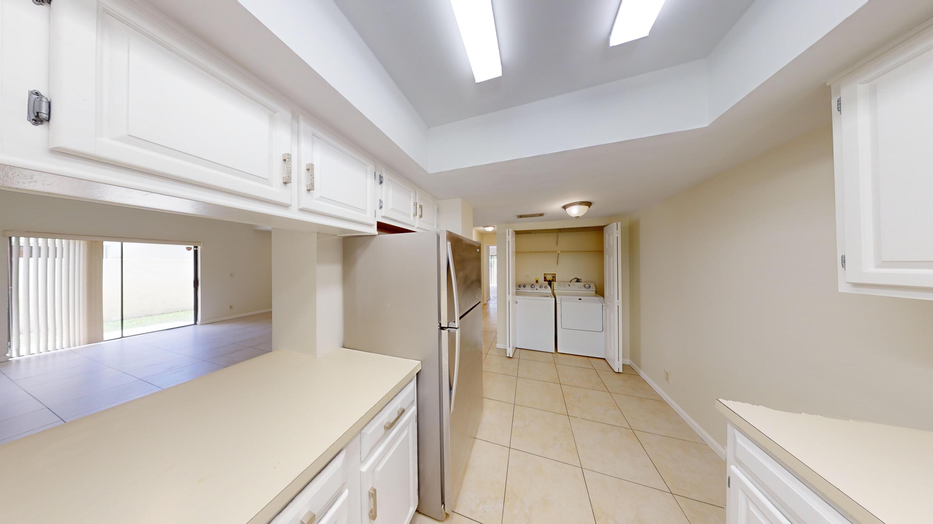 3149 Kingswood Terrace Boca Raton, FL 33431 - Photo 7 of 16 a bathroom with a sink and a mirror