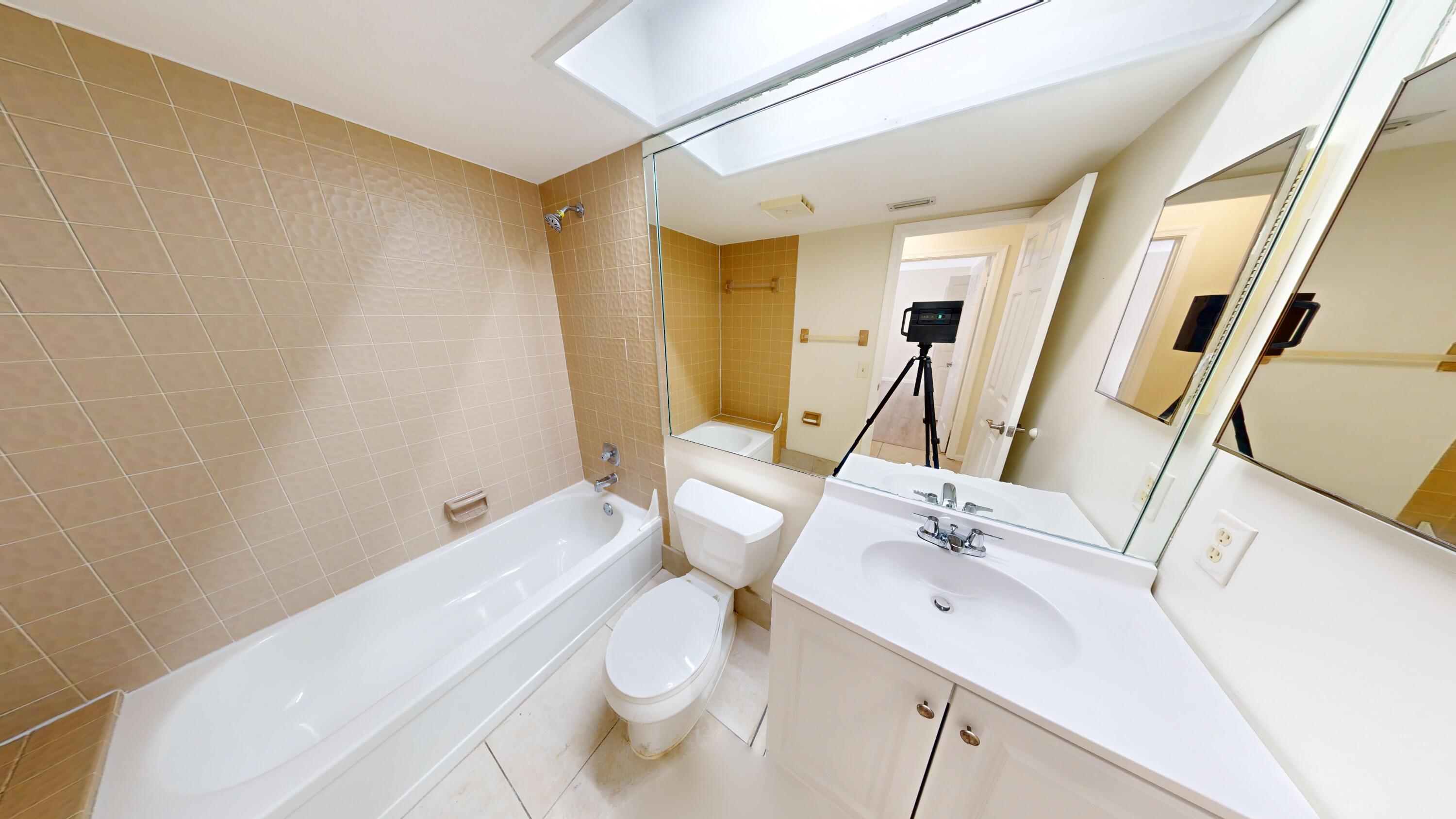 3149 Kingswood Terrace Boca Raton, FL 33431 - Photo 10 of 16 a bathroom with a sink a toilet and shower