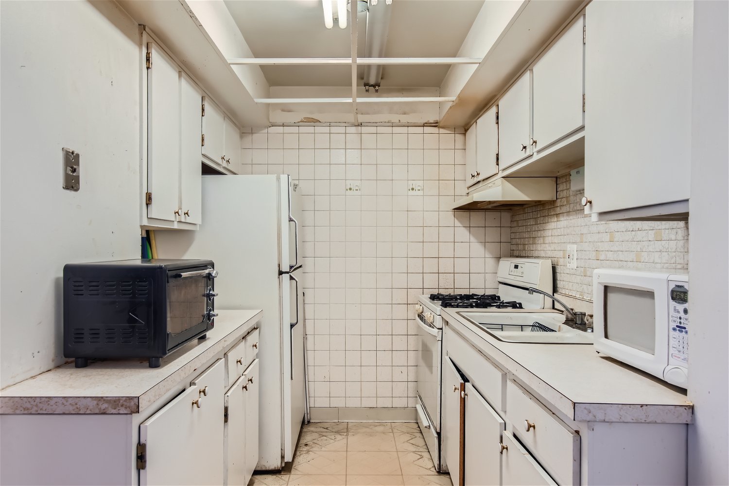 10820 Kilpatrick Avenue, Unit 2SW Oak Lawn, IL 60453 - Photo 5 of 11 a kitchen with stainless steel appliances a stove a sink and a refrigerator