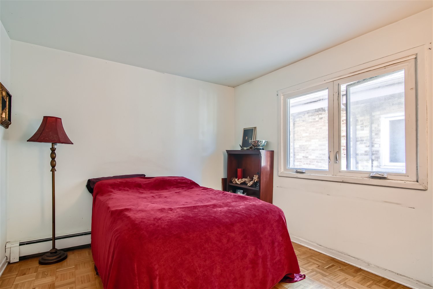 10820 Kilpatrick Avenue, Unit 2SW Oak Lawn, IL 60453 - Photo 8 of 11 a bed sitting in a bedroom next to a window