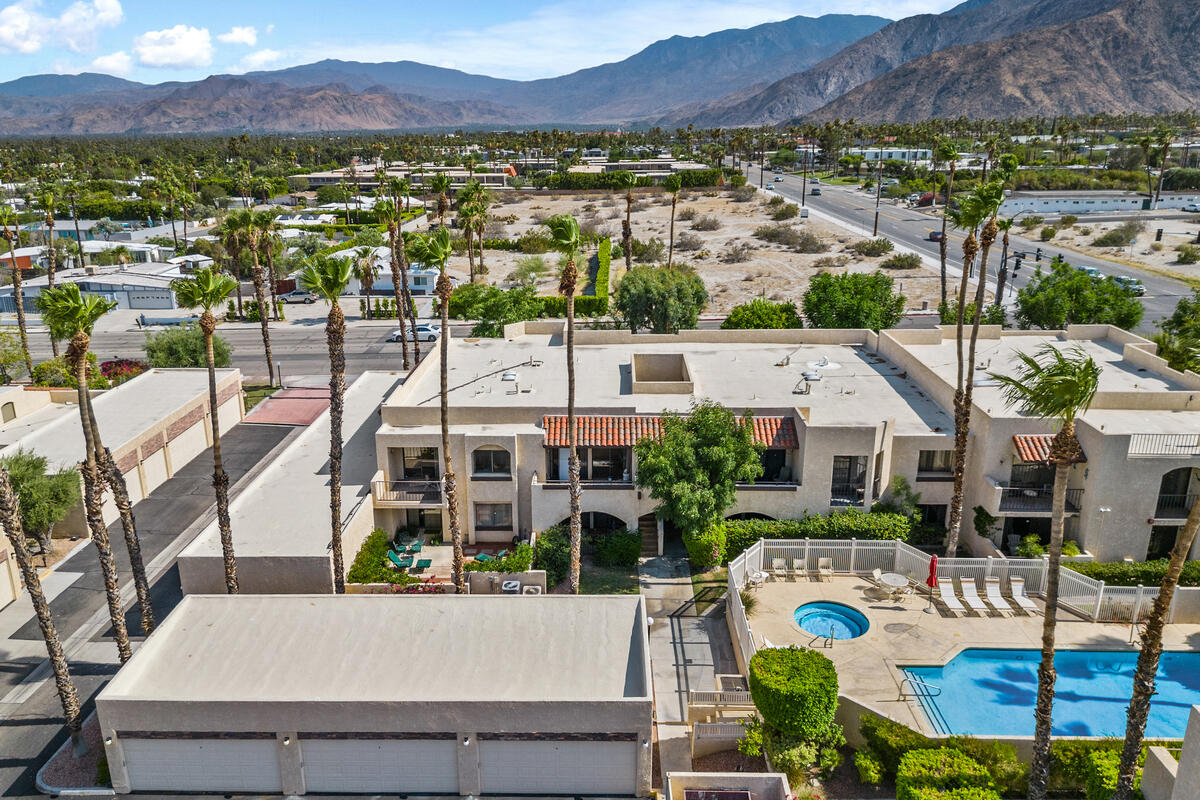 an aerial view of residential houses and outdoor space