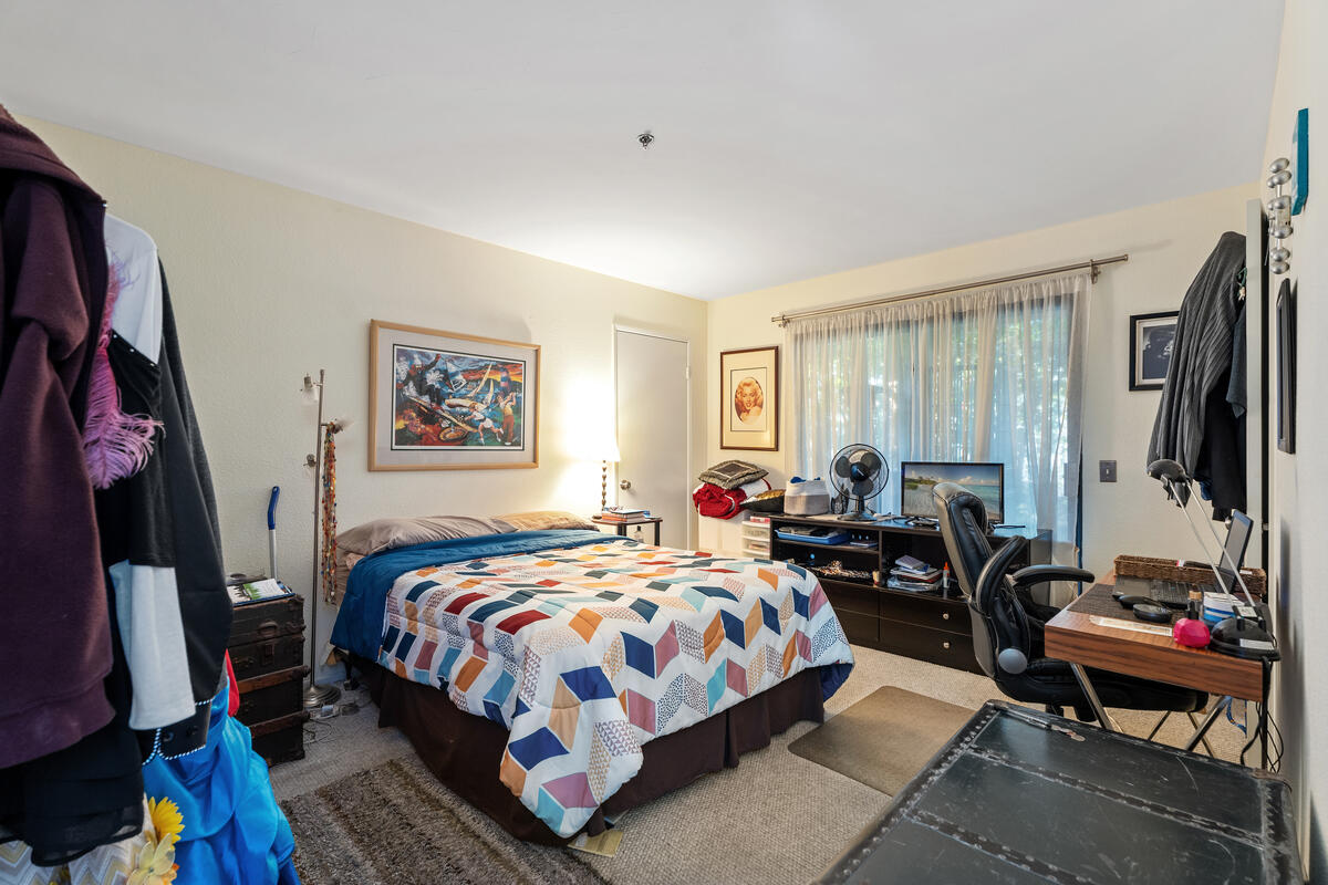 200 East Racquet Club Road, Unit 69 Palm Springs, CA 92262 - Photo 15 of 44 a bedroom with bed and a window