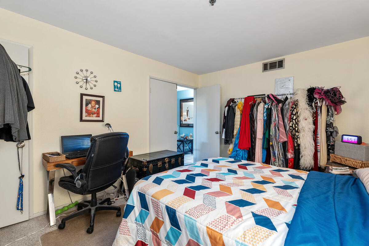 200 East Racquet Club Road, Unit 69 Palm Springs, CA 92262 - Photo 16 of 44 a bed room with a bed and a chair