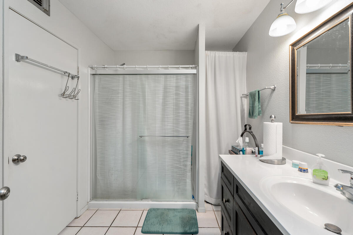 200 East Racquet Club Road, Unit 69 Palm Springs, CA 92262 - Photo 18 of 44 a bathroom with a sink and a mirror