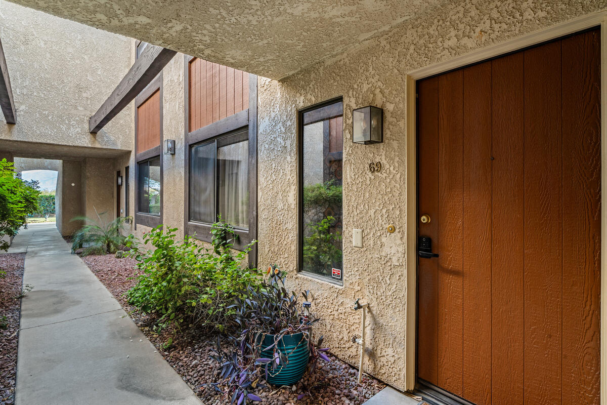 200 East Racquet Club Road, Unit 69 Palm Springs, CA 92262 - Photo 2 of 44 a view of a small house with potted plants