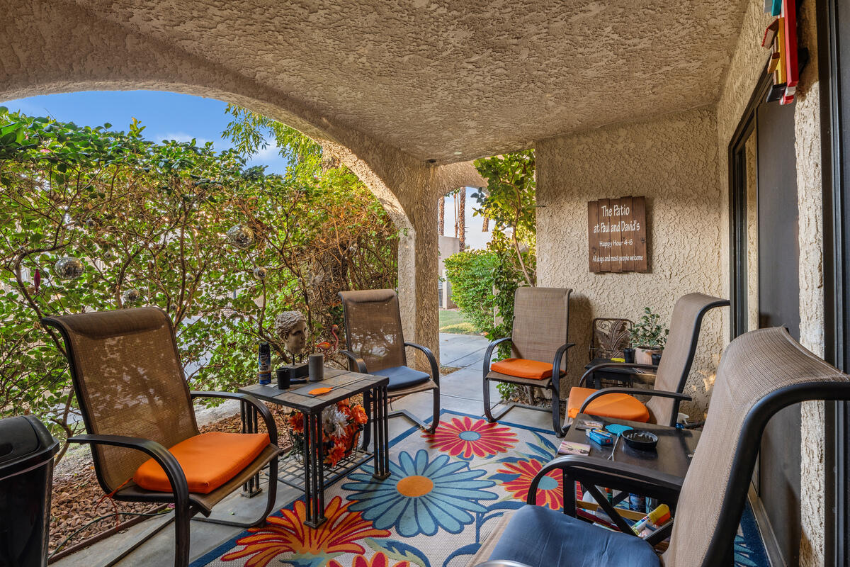 200 East Racquet Club Road, Unit 69 Palm Springs, CA 92262 - Photo 23 of 44 a outdoor living space with furniture and garden view