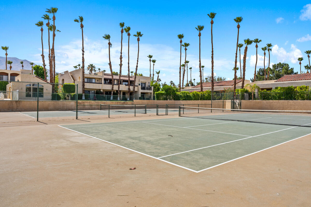 200 East Racquet Club Road, Unit 69 Palm Springs, CA 92262 - Photo 27 of 44 a view of a tennis court