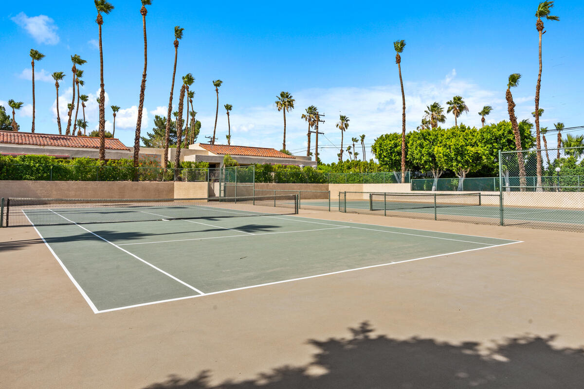200 East Racquet Club Road, Unit 69 Palm Springs, CA 92262 - Photo 29 of 44 a view of a tennis court