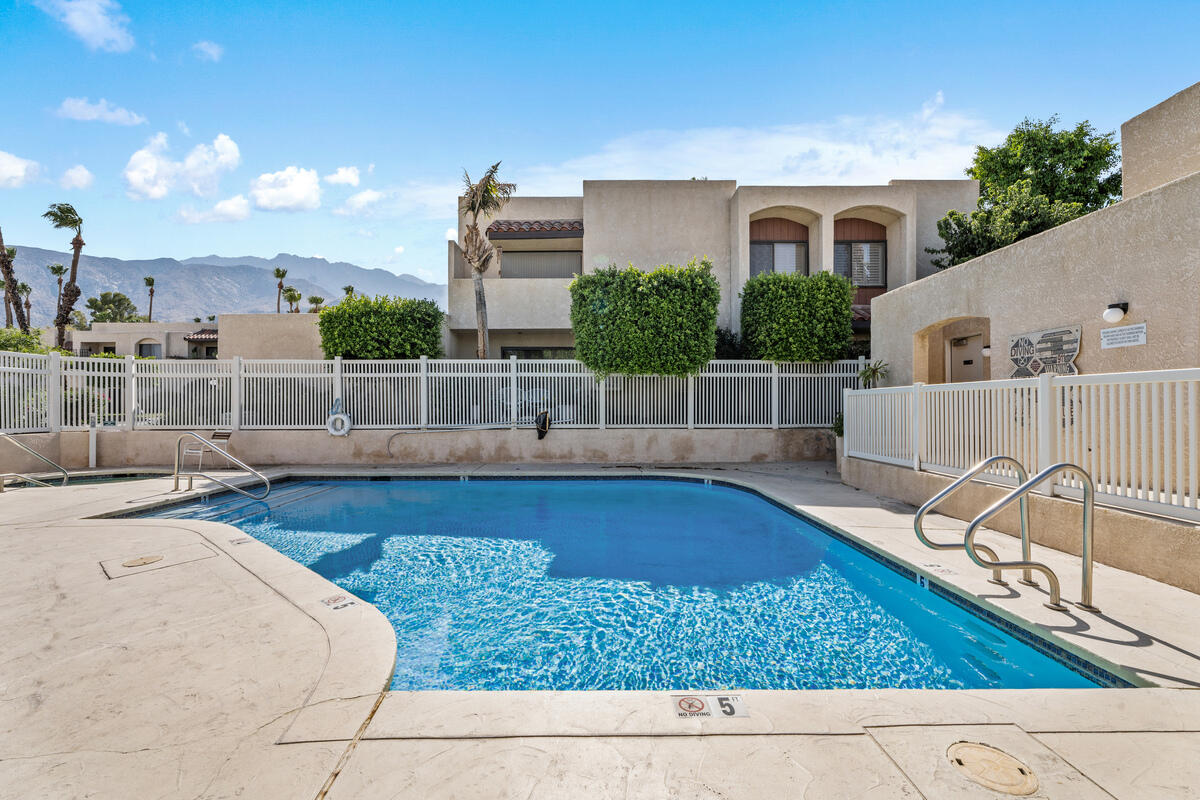 200 East Racquet Club Road, Unit 69 Palm Springs, CA 92262 - Photo 30 of 44 a view of a swimming pool with a patio