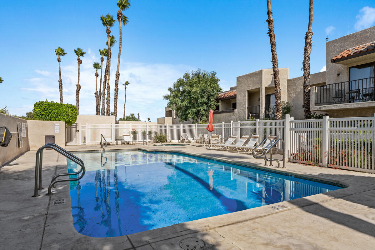 200 East Racquet Club Road, Unit 69 Palm Springs, CA 92262 - Photo 34 of 44 a view of a swimming pool with outdoor seating