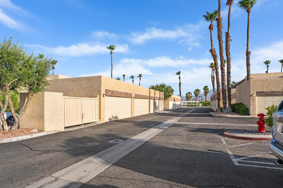 200 East Racquet Club Road, Unit 69 Palm Springs, CA 92262 - Photo 36 of 44 a view of a street with a building in the background