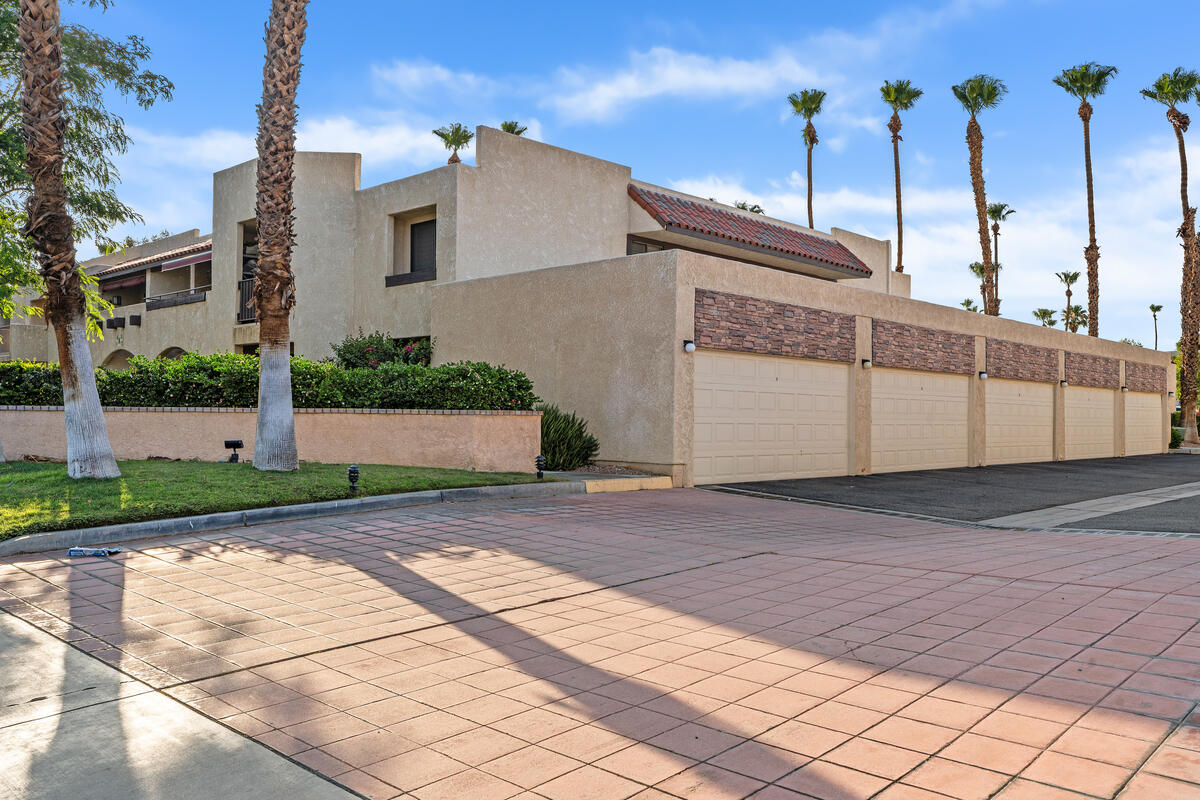 200 East Racquet Club Road, Unit 69 Palm Springs, CA 92262 - Photo 39 of 44 a view of a house with a yard and potted plants
