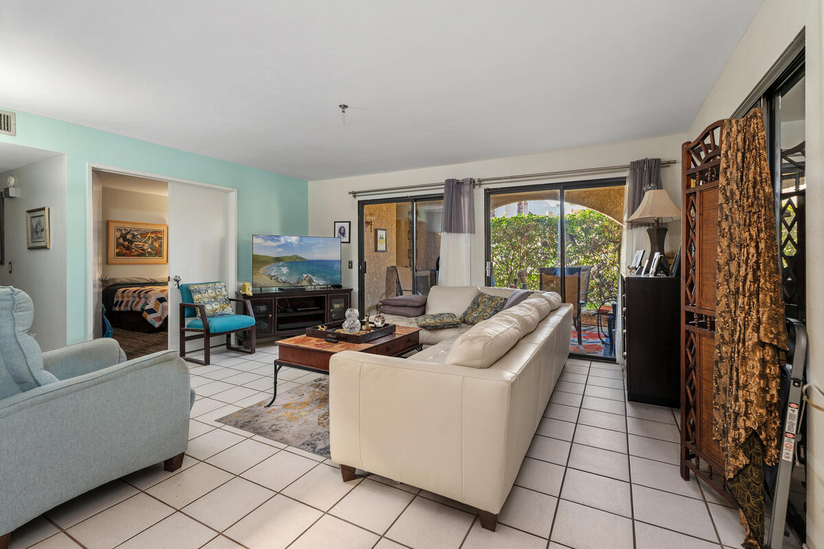 200 East Racquet Club Road, Unit 69 Palm Springs, CA 92262 - Photo 6 of 44 a living room with furniture and a large window
