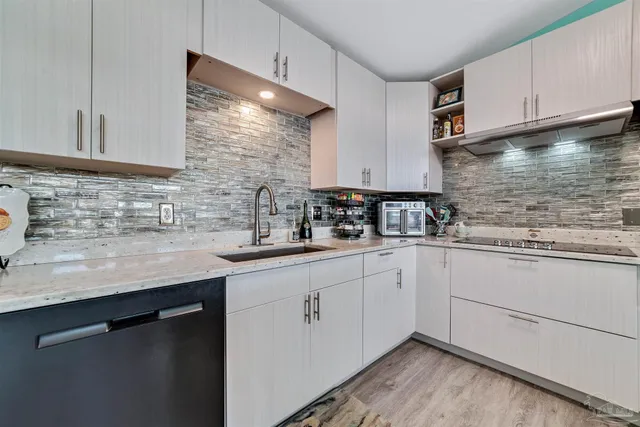 a kitchen with sink cabinets and window