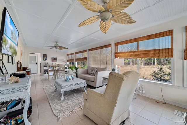 a living room with fireplace furniture and a flat screen tv