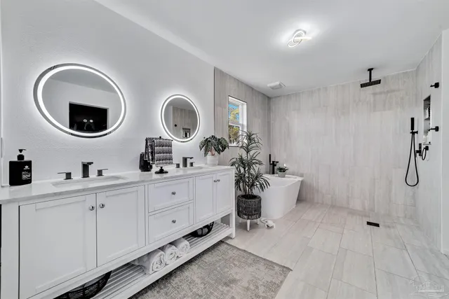 a very nice looking room with a chair and white walls