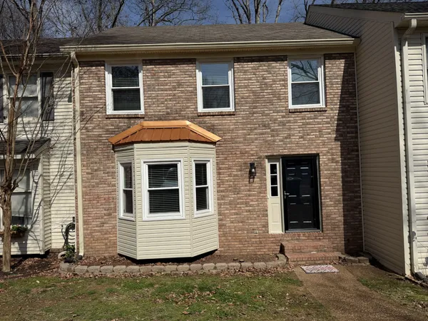 a front view of a house with windows