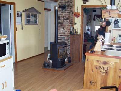 610 Blaine Road Granger, WA 98932 - Photo 5 of 9 a view of a living room and hallway with wooden floor
