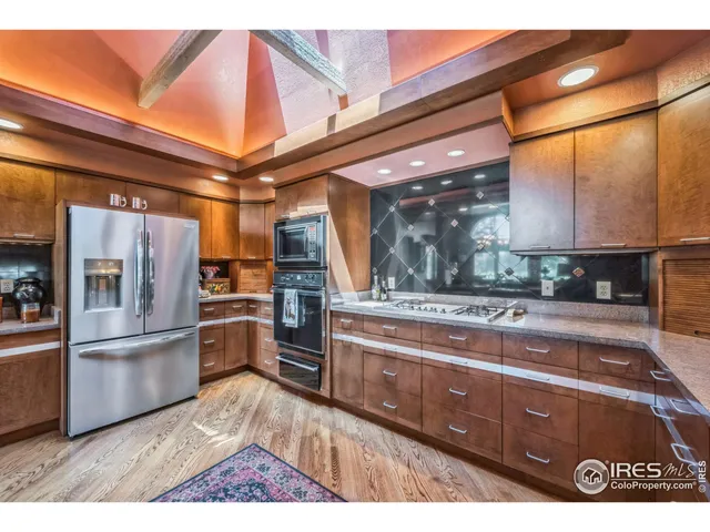 a living room with furniture and large windows