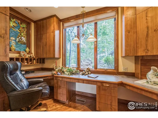 a dining room filled with furniture and window