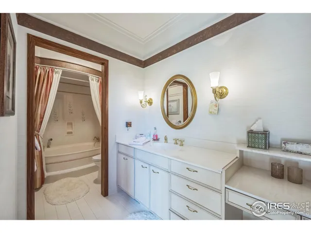 a bed room with furniture and a table