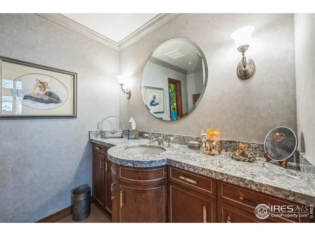 a view of a kitchen with a sink a washer and dryer