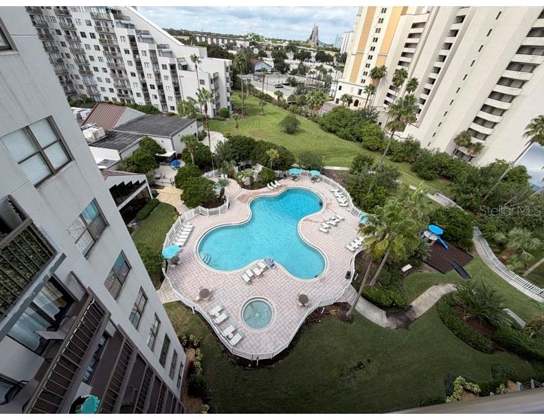 6165 Carrier Drive, Unit 1903 Orlando, FL 32819 - Photo 17 of 21 an aerial view of a house yard swimming pool and outdoor seating