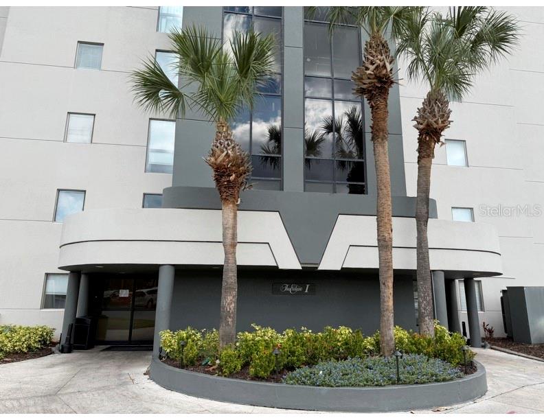 6165 Carrier Drive, Unit 1903 Orlando, FL 32819 - Photo 21 of 21 a front view of a house with garden