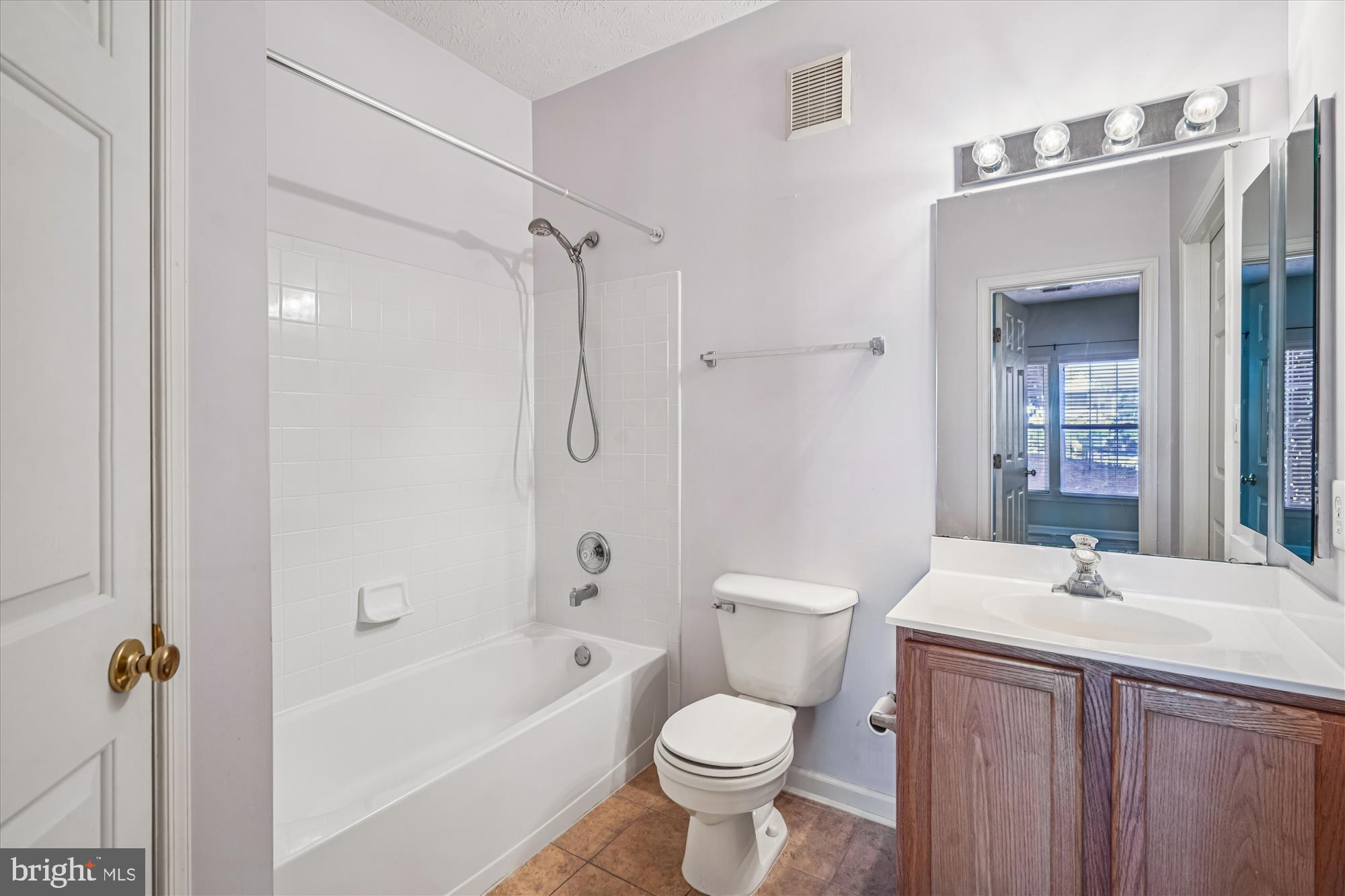 2412 Chestnut Terrace Court, Unit 104 Odenton, MD 21113 - Photo 20 of 42 a bathroom with a sink toilet a shower and bathtub