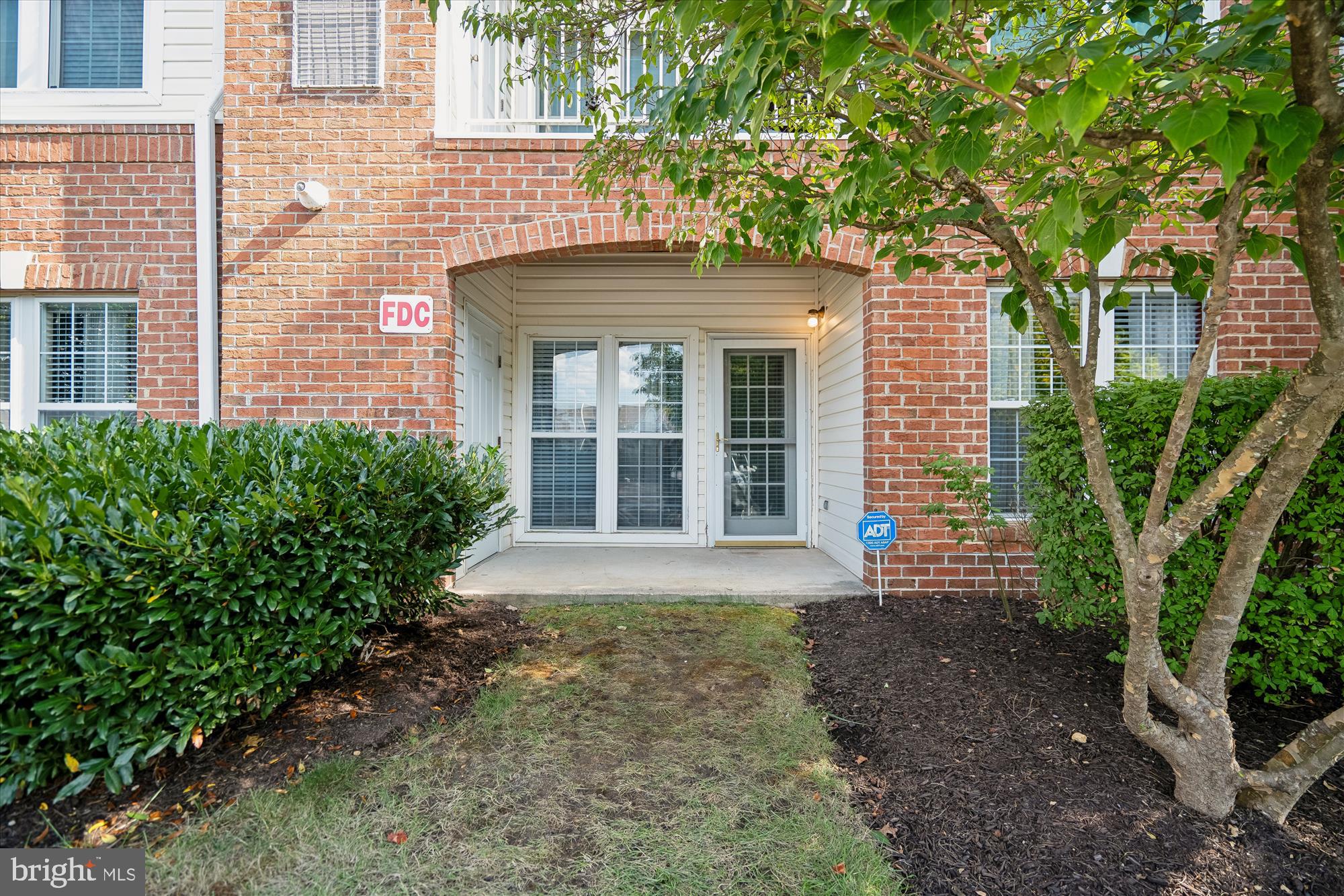 2412 Chestnut Terrace Court, Unit 104 Odenton, MD 21113 - Photo 23 of 42 a front view of a house with garden