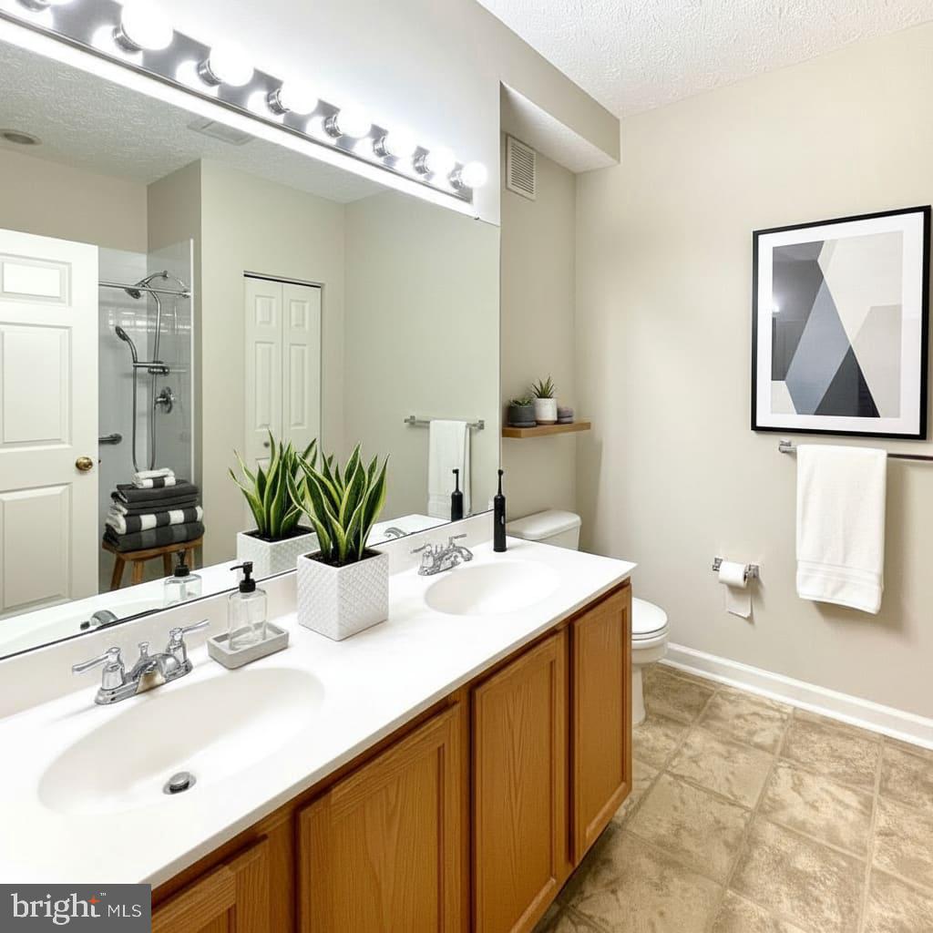 2412 Chestnut Terrace Court, Unit 104 Odenton, MD 21113 - Photo 5 of 42 a bathroom with a sink and a mirror